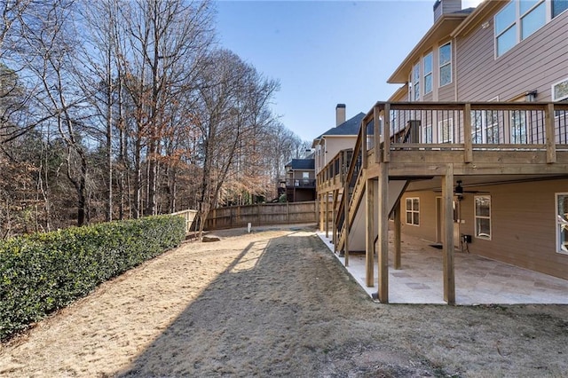 view of yard featuring a deck and a patio area