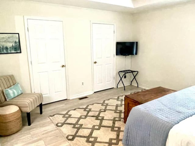 bedroom with light hardwood / wood-style floors