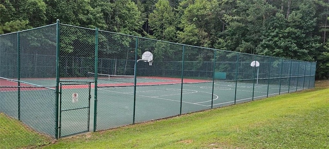 view of basketball court featuring a lawn