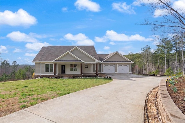 craftsman-style house with covered porch, driveway, an attached garage, and a front yard