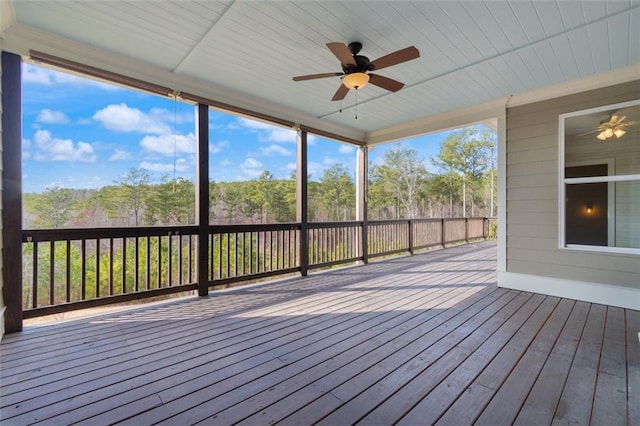 unfurnished sunroom with plenty of natural light and ceiling fan