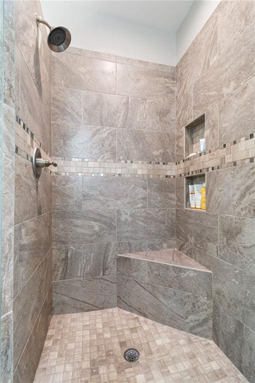 full bathroom with tiled shower