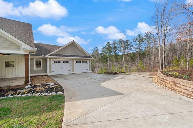 view of property exterior with a garage, roof with shingles, and concrete driveway