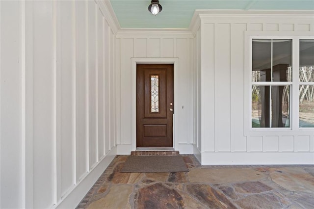 view of exterior entry with board and batten siding