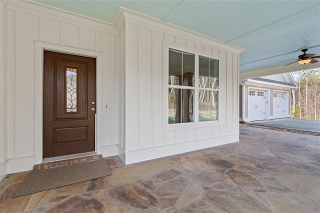 doorway to property featuring board and batten siding