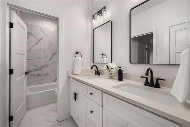 7262 Creekside Way, Jefferson, GA 30549 - bathroom featuring marble look tiles, double vanity, and shower / bathtub combination