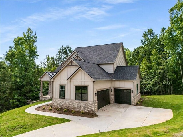 7262 Creekside Way, Jefferson, GA 30549 - modern farmhouse style home with board and batten siding, a garage, roof with shingles, a front lawn, and driveway