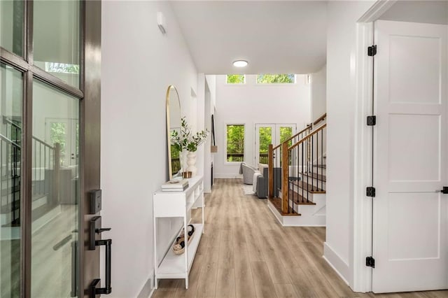 7262 Creekside Way, Jefferson, GA 30549 - foyer featuring stairs, light wood-style flooring, and a high ceiling