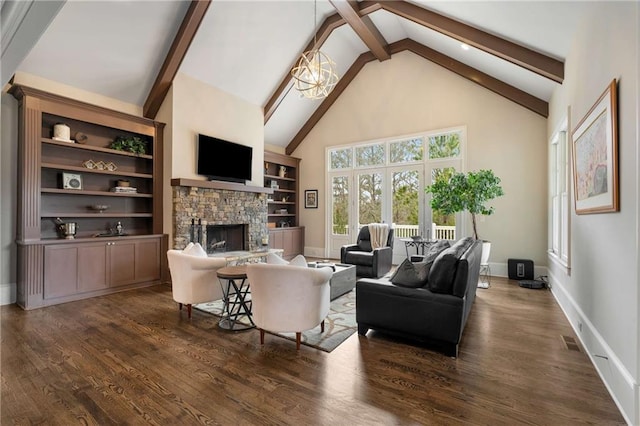 living area with dark wood-style floors, a notable chandelier, a fireplace, and beamed ceiling