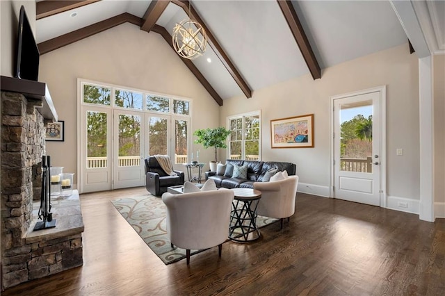 living area featuring high vaulted ceiling, beamed ceiling, baseboards, and wood finished floors