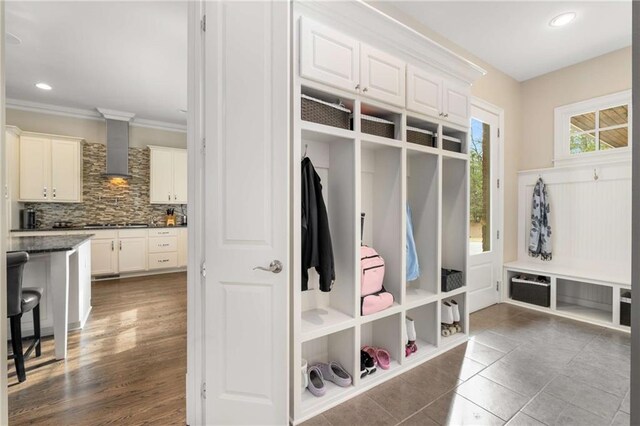 mudroom featuring dark wood-style floors, recessed lighting, and crown molding