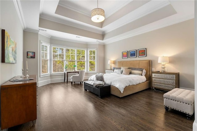 bedroom featuring visible vents, ornamental molding, a raised ceiling, and dark wood finished floors