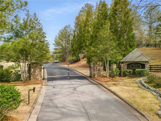 view of gate with fence