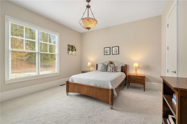 carpeted bedroom with baseboards