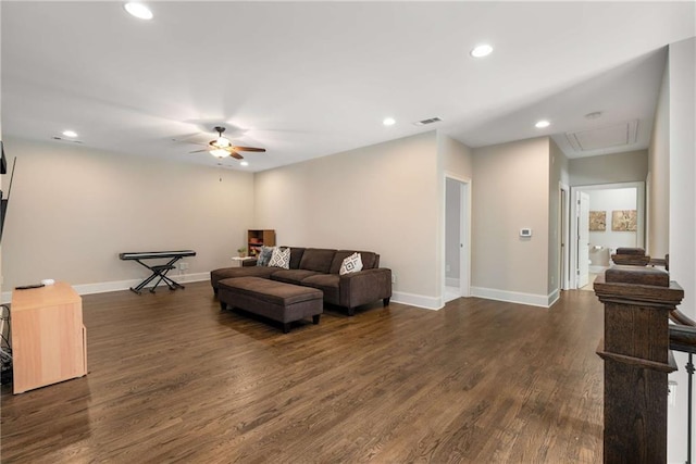 living area featuring visible vents, baseboards, a ceiling fan, dark wood-style floors, and recessed lighting