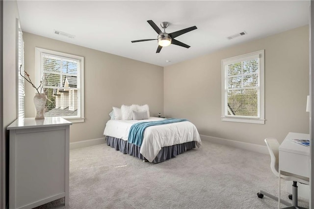 bedroom with carpet floors, visible vents, and baseboards