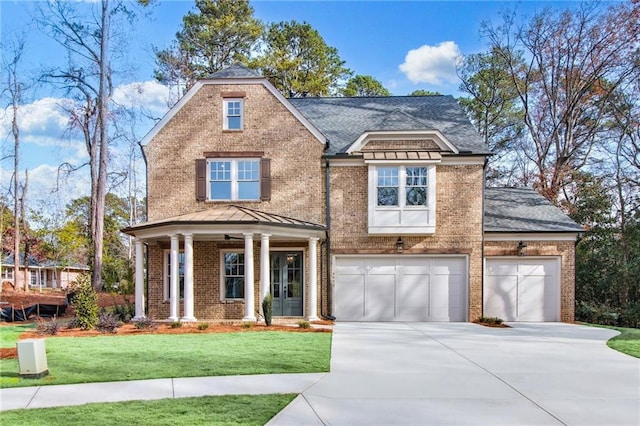 view of front facade featuring a garage and a front yard