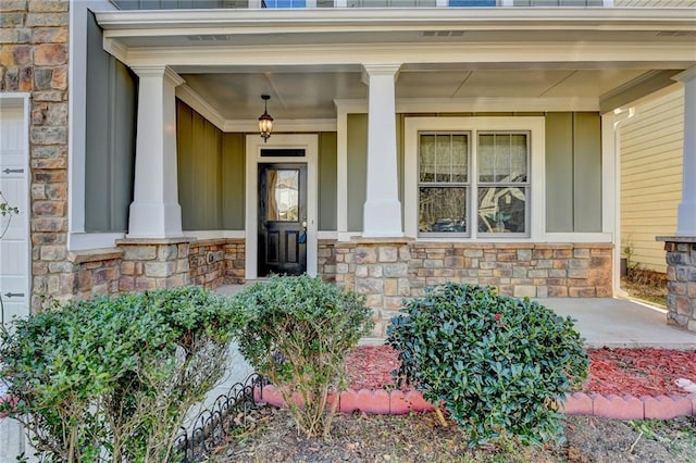 entrance to property featuring a porch