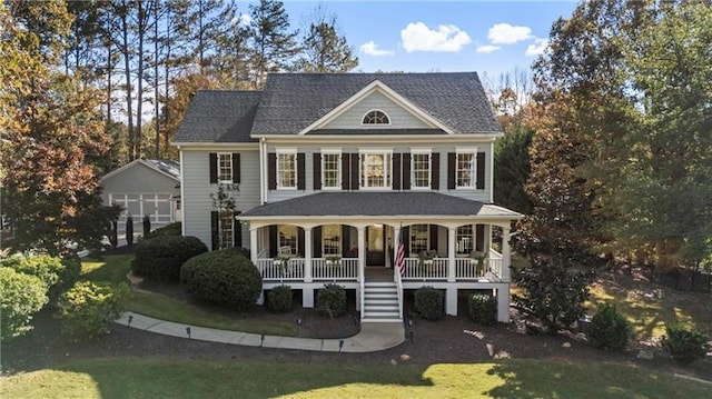 view of front of property with a front yard and covered porch