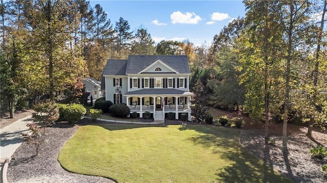 view of front of house featuring a porch and a front yard