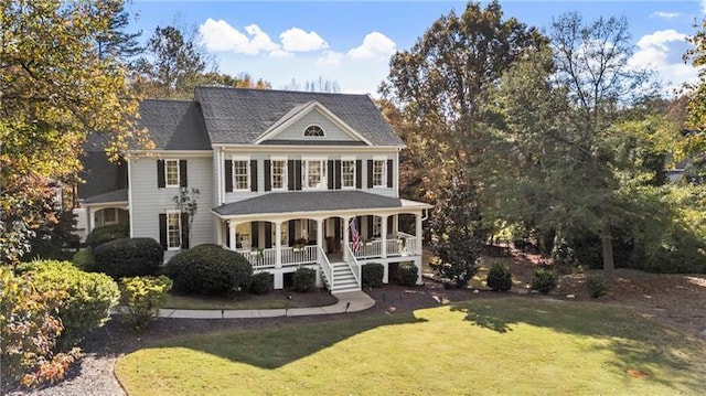 view of front of property featuring a front yard and covered porch