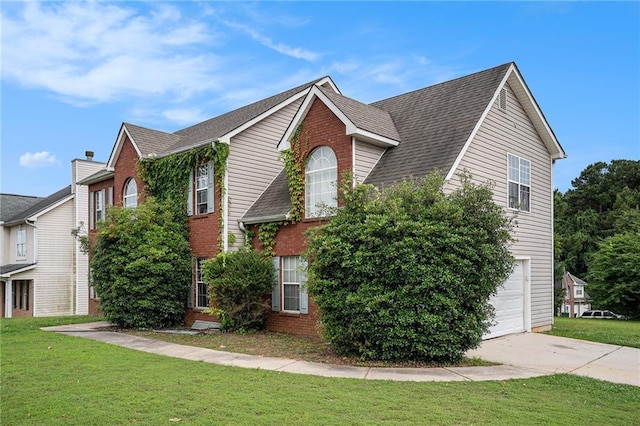 1135 Misty Meadows Way, Hampton, GA 30229 - view of front of property featuring an attached garage, brick siding, and a front lawn