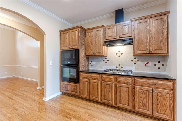 5170 Stone Croft Trl, Atlanta, GA 30331 - kitchen featuring light hardwood / wood-style flooring, ornamental molding, tasteful backsplash, black microwave, and stainless steel gas cooktop