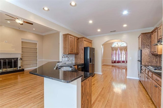 5170 Stone Croft Trl, Atlanta, GA 30331 - kitchen featuring sink, stainless steel appliances, built in features, kitchen peninsula, and dark stone counters
