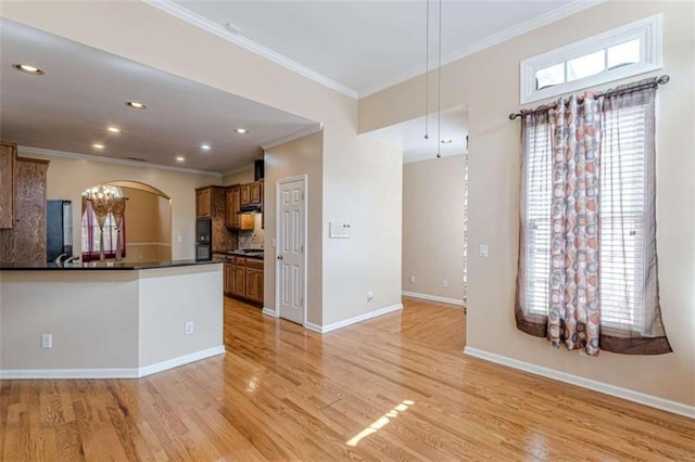 5170 Stone Croft Trl, Atlanta, GA 30331 - kitchen with light wood-type flooring, refrigerator, backsplash, ornamental molding, and a notable chandelier