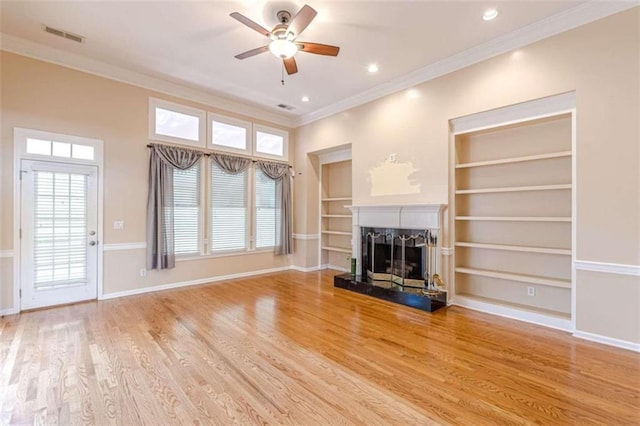 5170 Stone Croft Trl, Atlanta, GA 30331 - unfurnished living room with built in shelves, ceiling fan, wood-type flooring, and ornamental molding