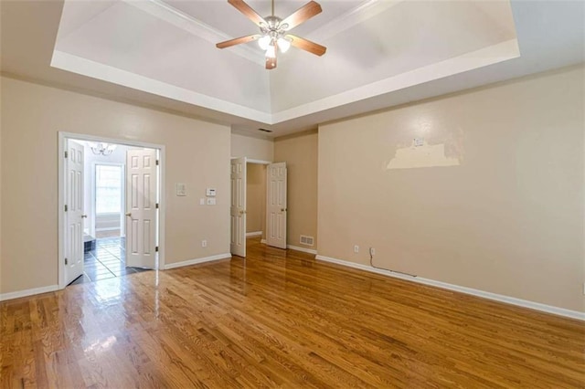 5170 Stone Croft Trl, Atlanta, GA 30331 - spare room with wood-type flooring, a raised ceiling, and ceiling fan