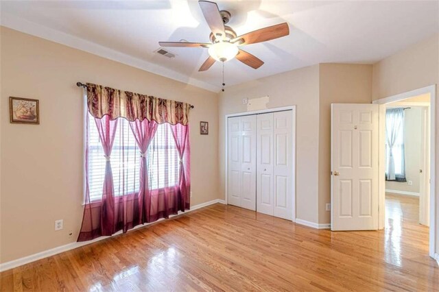 5170 Stone Croft Trl, Atlanta, GA 30331 - unfurnished bedroom featuring ceiling fan, a closet, and light hardwood / wood-style flooring
