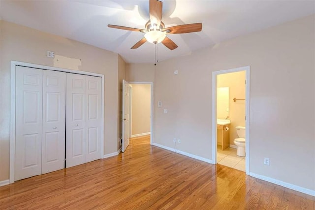 5170 Stone Croft Trl, Atlanta, GA 30331 - unfurnished bedroom featuring connected bathroom, a closet, light hardwood / wood-style flooring, and ceiling fan