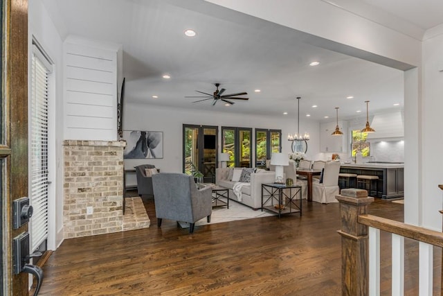 1461 Bubbling Creek Rd NE, Brookhaven, GA 30319 - living room with wood finished floors, recessed lighting, a ceiling fan, and a chandelier