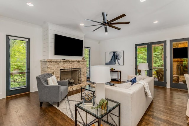 1461 Bubbling Creek Rd NE, Brookhaven, GA 30319 - living area featuring ceiling fan, dark wood finished floors, a brick fireplace, crown molding, and recessed lighting