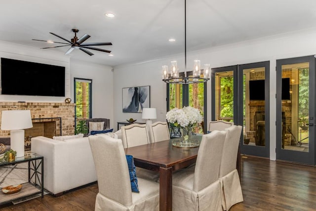 1461 Bubbling Creek Rd NE, Brookhaven, GA 30319 - dining room featuring a chandelier, ornamental molding, wood finished floors, a fireplace, and recessed lighting