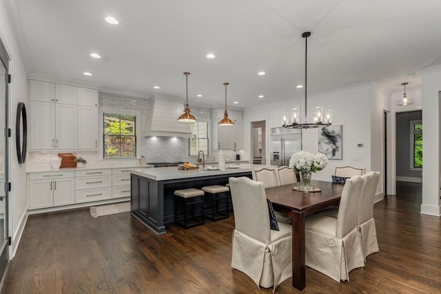 1461 Bubbling Creek Rd NE, Brookhaven, GA 30319 - dining room with plenty of natural light, a chandelier, recessed lighting, crown molding, and dark wood-style floors