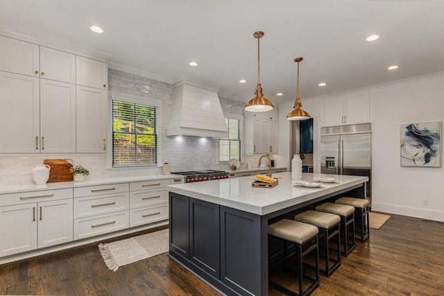 1461 Bubbling Creek Rd NE, Brookhaven, GA 30319 - kitchen with premium range hood, light countertops, decorative backsplash, white cabinetry, and recessed lighting