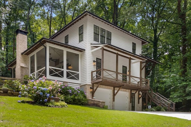 1461 Bubbling Creek Rd NE, Brookhaven, GA 30319 - view of side of property featuring a lawn, a garage, a chimney, a ceiling fan, and concrete driveway