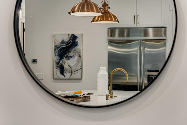 1461 Bubbling Creek Rd NE, Brookhaven, GA 30319 - kitchen view of stainless steel refrigerator with ice dispenser and pendant lighting