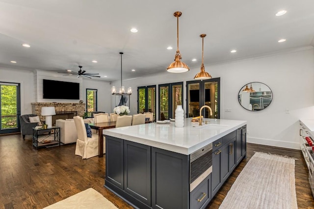 1461 Bubbling Creek Rd NE, Brookhaven, GA 30319 - kitchen with a sink, dark wood-style floors, ceiling fan, light countertops, and baseboards