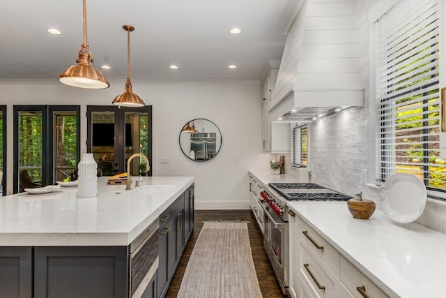 1461 Bubbling Creek Rd NE, Brookhaven, GA 30319 - kitchen with appliances with stainless steel finishes, baseboards, a sink, dark wood-style floors, and recessed lighting