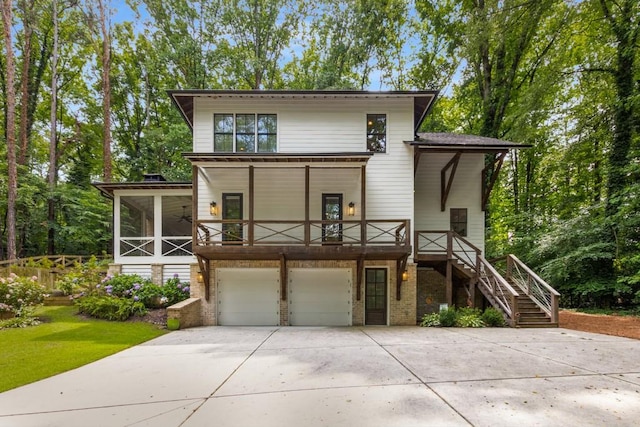 1461 Bubbling Creek Rd NE, Brookhaven, GA 30319 - modern home with stairs, driveway, an attached garage, brick siding, and a sunroom