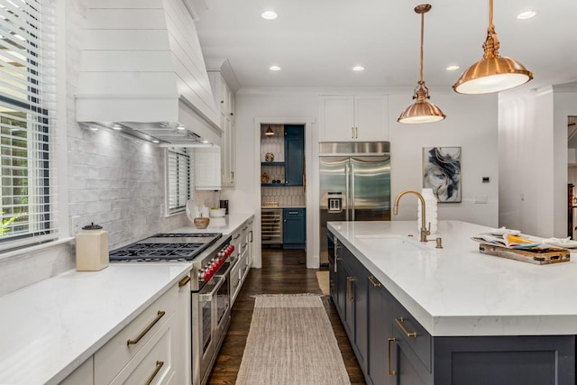 1461 Bubbling Creek Rd NE, Brookhaven, GA 30319 - kitchen featuring premium appliances, beverage cooler, a sink, white cabinetry, and dark wood-style flooring