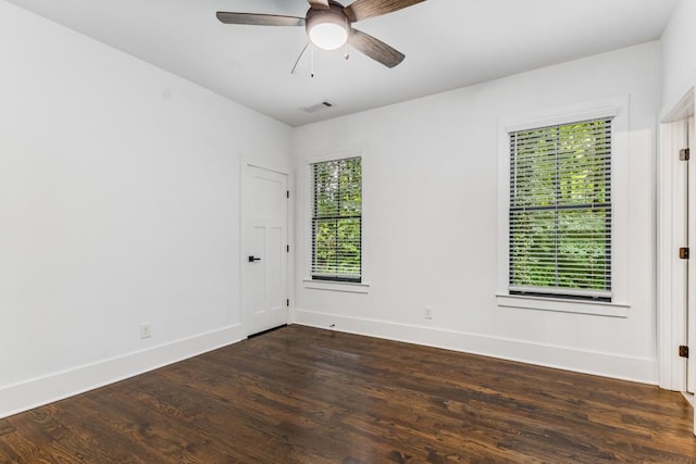 1461 Bubbling Creek Rd NE, Brookhaven, GA 30319 - empty room with dark wood-style flooring, a ceiling fan, and baseboards