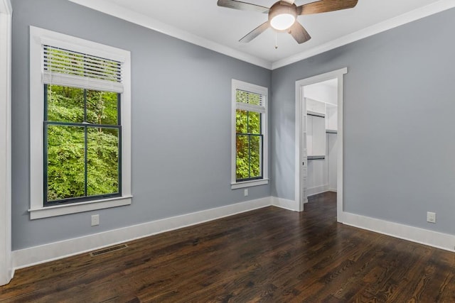1461 Bubbling Creek Rd NE, Brookhaven, GA 30319 - empty room featuring plenty of natural light, baseboards, wood finished floors, ceiling fan, and ornamental molding