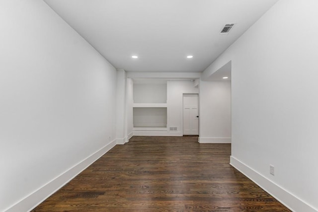 1461 Bubbling Creek Rd NE, Brookhaven, GA 30319 - unfurnished room with recessed lighting, dark wood-type flooring, baseboards, and built in shelves