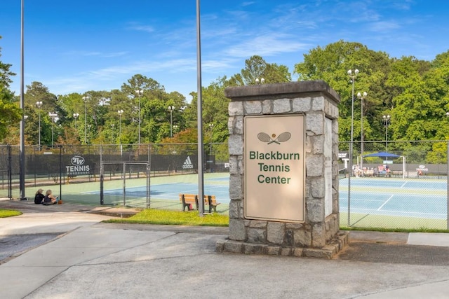 1461 Bubbling Creek Rd NE, Brookhaven, GA 30319 - view of tennis court featuring view of wooded area