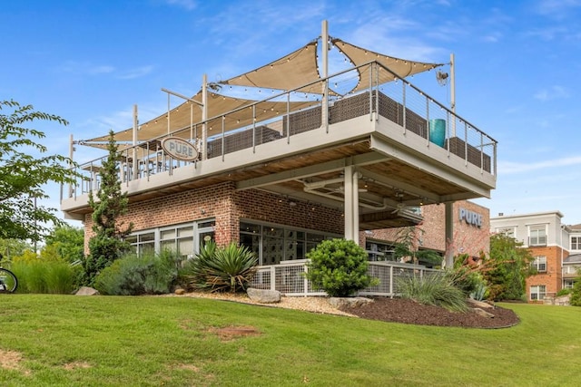 1461 Bubbling Creek Rd NE, Brookhaven, GA 30319 - back of house with brick siding, a lawn, and a balcony