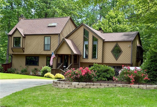 2694 Tritt Springs Dr NE, Marietta, GA 30062 - view of front facade with a chimney, a porch, and a front lawn